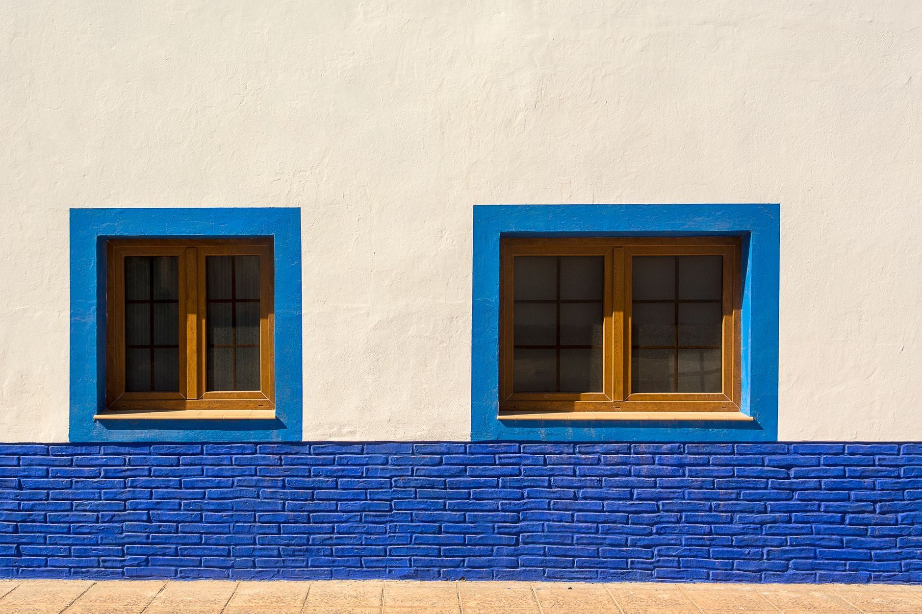 Window frames and sills on a brick home exterior